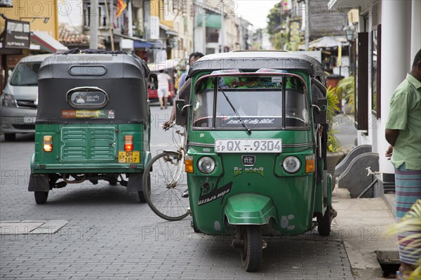 Motorised rickshaw tu-tuk vehicles street of historic town of Galle, Sri Lanka, Asia