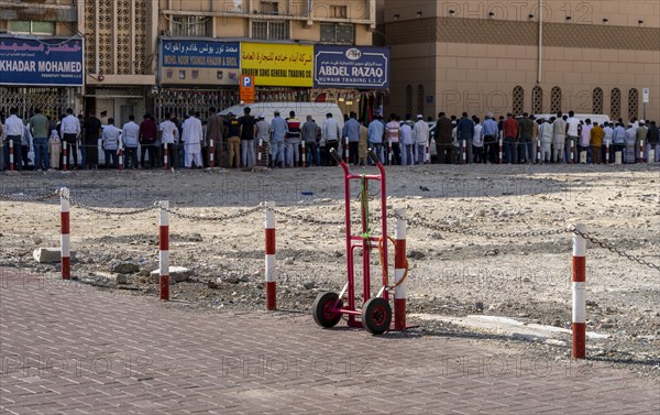 Midday prayer in front of a mosque, Al Fahidi neighbourhood, Dubai, United Arab Emirates, Asia