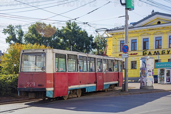 Red Russian tram KTM-5M3 71-605, Soviet streetcar in the city centre of Tomsk, Tomsk Oblast, Siberia, Russia, Europe