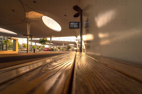 Sunset atmosphere at a bus stop from the ground perspective, bus station, Pforzheim, Germany, Europe