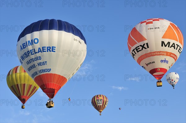 Balloonists, Aeronauts flying in hot-air balloons during ballooning meeting