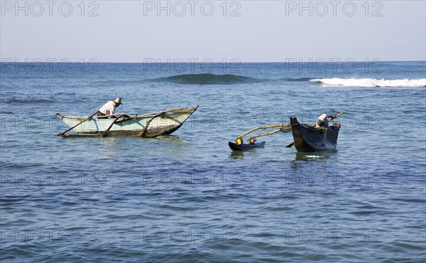 Fishing using traditional outrigger canoes, Mirissa, Sri Lanka, Asia