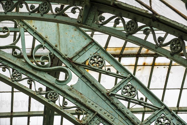 Detail of decorated wrought-iron truss of the Royal Greenhouses of Laeken in Art Nouveau style, designed by Alphonse Balat in the park of the Royal Palace of Laken, Brussels, Belgium, Europe