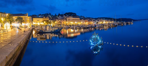 Blue hour, illuminated Christmas tree in the harbour basin, panoramic viewHarbour of Mali Losinj, island of Losinj, Kvarner Gulf Bay, Adriatic Sea, Croatia, Europe