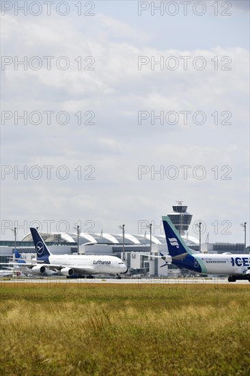 Lufthansa Airbus A380-800 with Iceland Air in front of Terminal 2, Munich Airport, Upper Bavaria, Bavaria, Germany, Europe