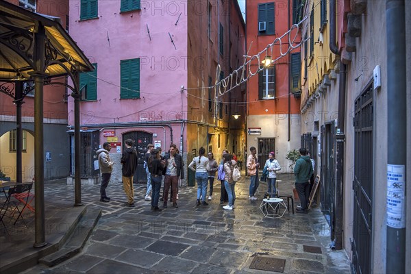 Meeting of students in the square of a historic wash house, Piazza Truogoli di Santa Brigida, Genoa, Italy, Europe