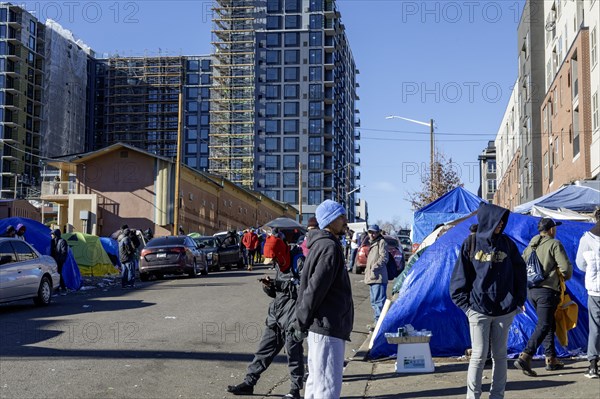 Denver, Colorado, Immigrants, mostly from Venezuela, live in a tent camp near downtown Denver. The city helped about 35, 000 migrants in 2023 with food and temporary shelter, but more continue to arrive daily on buses from the southern border