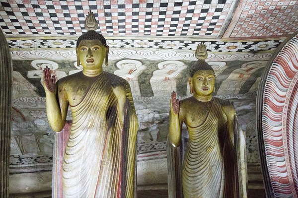 Buddha figures inside Dambulla cave Buddhist temple complex, Sri Lanka, Asia