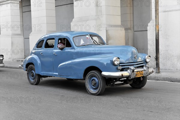 Blue vintage car from the 50s in Avenida Simon Bolivar, Calle Reina, centre of Havana, Centro Habana, Cuba, Greater Antilles, Caribbean, Central America