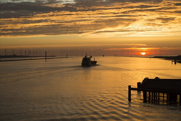 Sunset orange glow landscape clouds water, North Sea shipping, Port of Rotterdam, Hook of Holland, Netherlands