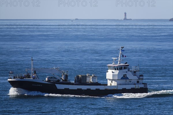 Transport ship Le Molenez for supplying the islands of Ouessant, Molene and Sein, here passing the Pointe Saint-Mathieu on its way to Brest, Plougonvelin, Finistere Penn ar Bed department, Bretagne Breizh region, France, Europe