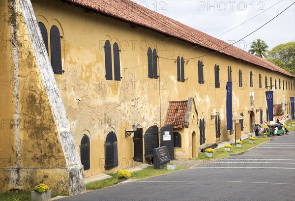 Motorised rickshaw at fort doorway exit in the historic town of Galle, Sri Lanka, Asia