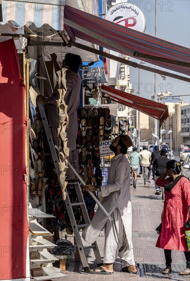 Shoe shops and craftsmen in the Al Fahidi neighbourhood, Dubai, United Arab Emirates, Asia