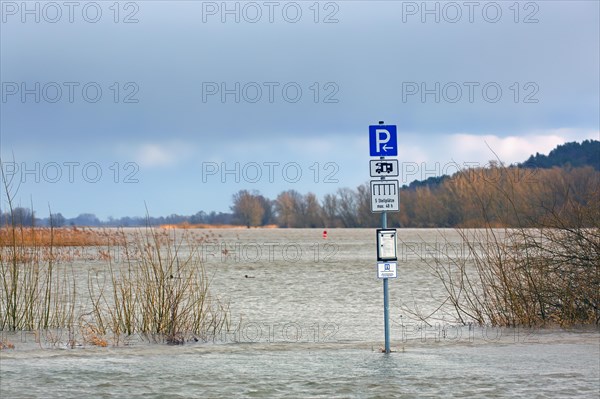 Flooded car park, parking for motorhomes, campervans at Lower Saxon Elbe Valley Biosphere Reserve in winter, Lower Saxony, Niedersachsen, Germany, Europe