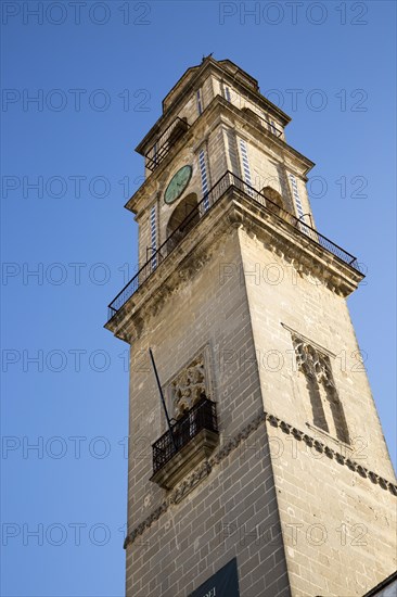 Cathedral church bell tower belfry in Jerez de la Frontera, Cadiz province, Spain against blue sky