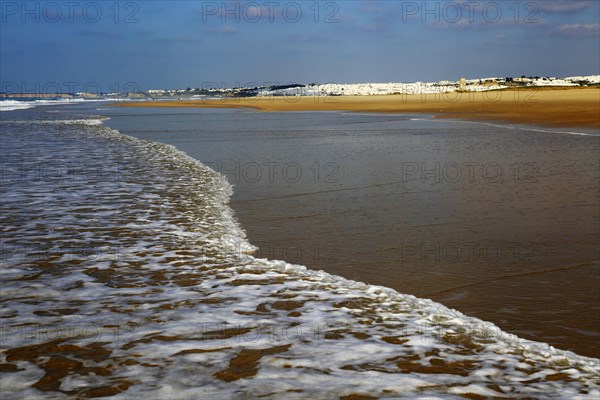 Wave breaking on sandy beach at Conil de la Frontera, Cadiz Province, Spain, Europe