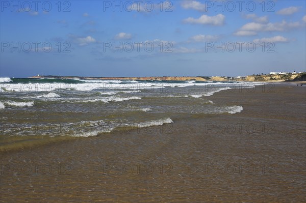 Waves breaking on sandy beach at Conil de la Frontera, Cadiz Province, Spain, Europe