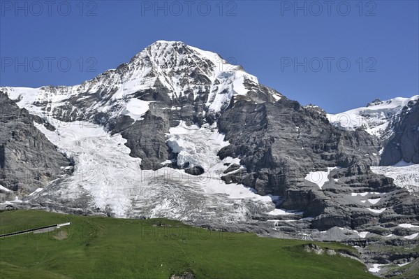 The Moench forms part of a mountain ridge between the Jungfrau and the Eiger in the Bernese Alps, Switzerland, Europe
