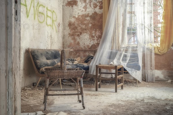 An abandoned living room with torn furniture and dust, flooded with daylight, urologist's villa Dr Anna L., Lost Place, Bad Wildungen, Hesse, Germany, Europe
