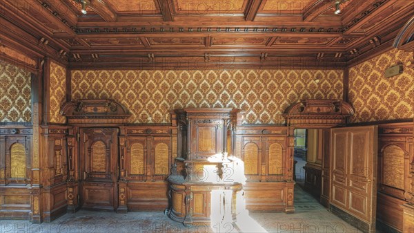 A sumptuously decorated room with wood panelling and antique furniture, Villa Woodstock, Lost Place, Wuppertal, North Rhine-Westphalia, Germany, Europe