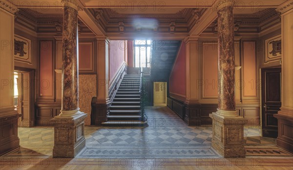 Magnificent entrance area with marble columns and a grand staircase in warm light, Villa Woodstock, Lost Place, Wuppertal, North Rhine-Westphalia, Germany, Europe