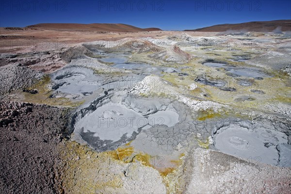 Mud lakes and steam pools with boiling mud in geothermal field Sol de Manana, Altiplano, Bolivia, South America