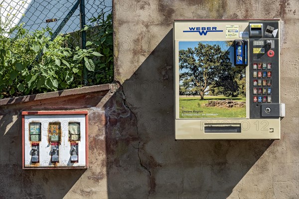 Chewing gum vending machine and cigarette vending machine together on a wall, vending machines for children and adults, chewing gum, cigarettes, Germany, Europe