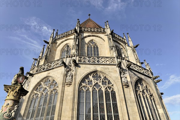 Heilig-Kreuz-Muenster, view from the east, built between 1210 and 1230, in front the lion fountain, Schwaebisch Gmuend, Baden-Wuerttemberg, Germany, Europe