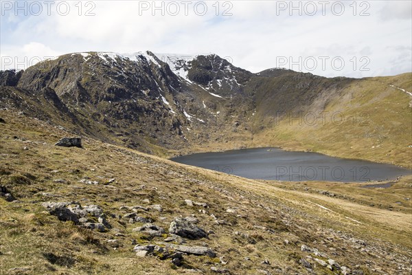 Striding Edge arete Helvellyn mountain peak and Red Tarn corrie lake, Lake District, Cumbria, England, UK