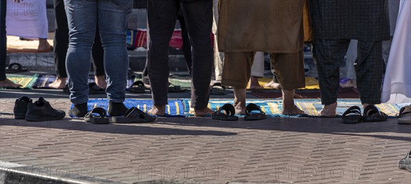 Midday prayer in front of a mosque, Al Fahidi neighbourhood, Dubai, United Arab Emirates, Asia