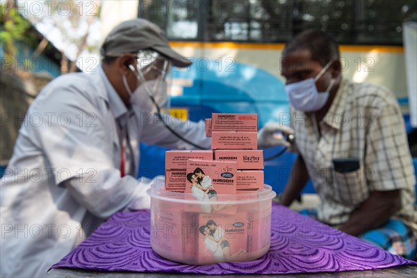 Condoms, doctor does health check for lorry drivers, Chennai, Tamil Nadu, India, Asia