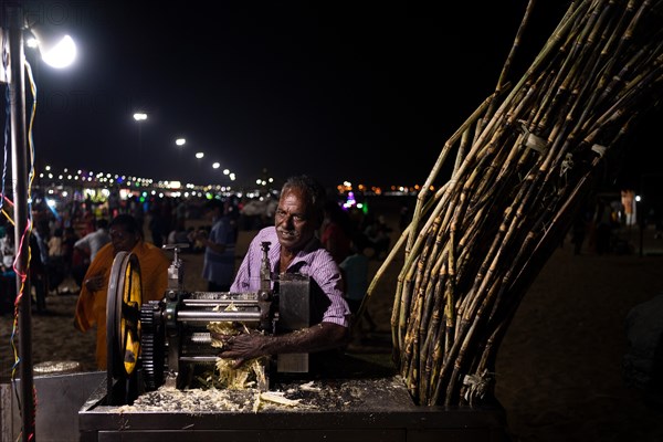 Sugarcane vendor, Marina Beach, Chennai, Tamil Nadu, India, Asia