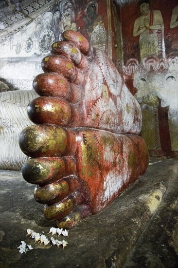 Buddha figure inside Dambulla cave Buddhist temple complex, Sri Lanka, Asia