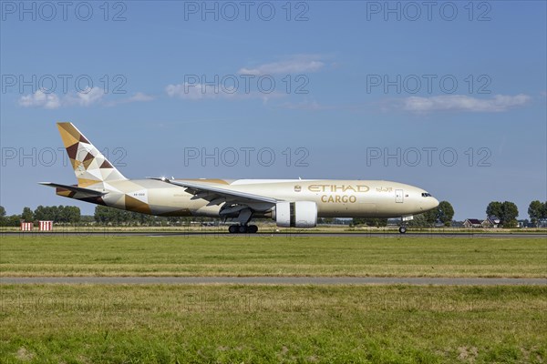 Etihad Cargo Boeing 777-FFX with registration A6-DDD lands on the Polderbaan, Amsterdam Schiphol Airport in Vijfhuizen, municipality of Haarlemmermeer, Noord-Holland, Netherlands