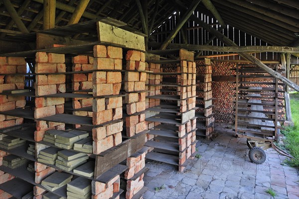Drying yard with bricks and tiles in shelves at brickworks, Boom, Belgium, Europe