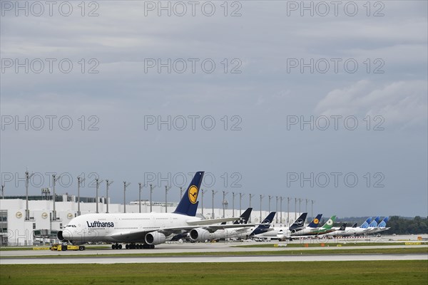 Lufthansa Airbus A380-800 in tow with push back truck in front of Terminal 2, Munich Airport, Upper Bavaria, Bavaria, Germany, Europe