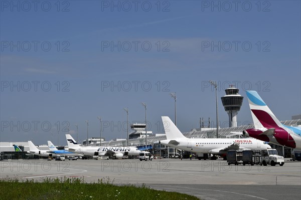 Overview Eurowings, Iberia, Finnair, KLM and Air Lingus aircraft at check-in position at Terminal 1 with control tower, Munich Airport, Upper Bavaria, Bavaria, Germany, Europe