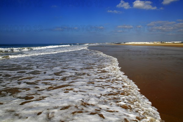 Wave breaking on sandy beach at Conil de la Frontera, Cadiz Province, Spain, Europe