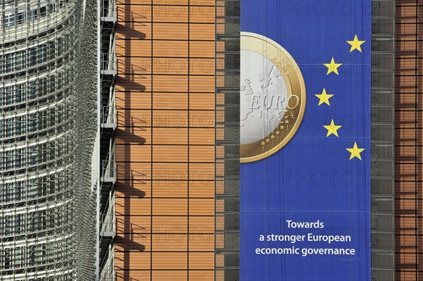 Banner about the euro hanging from the Berlaymont building of the European Commission, executive body of the European Union, Brussels, Belgium, Europe