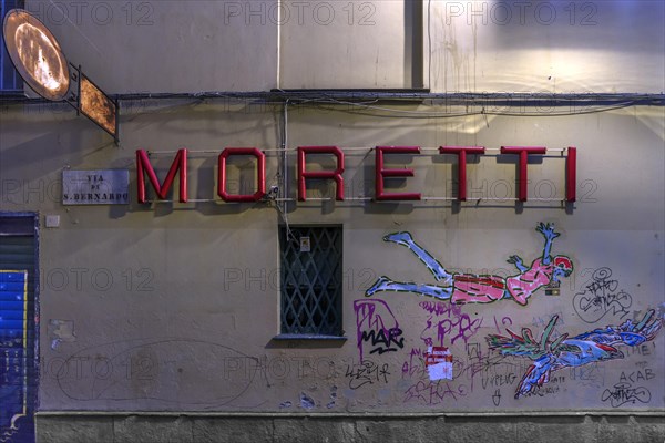 Moretti, lettering of a bar, underneath graffiti on a house wall, historic centre, Genoa, Italy, Europe