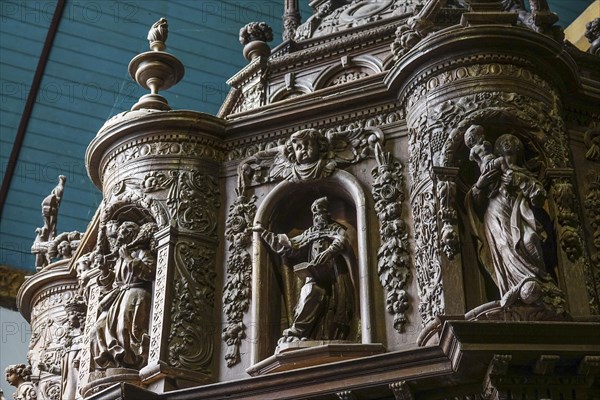 Renaissance-style carved canopy of the baptismal font, Enclos Paroissial enclosed parish of Guimiliau, Finistere Penn ar Bed department, Brittany Breizh region, France, Europe