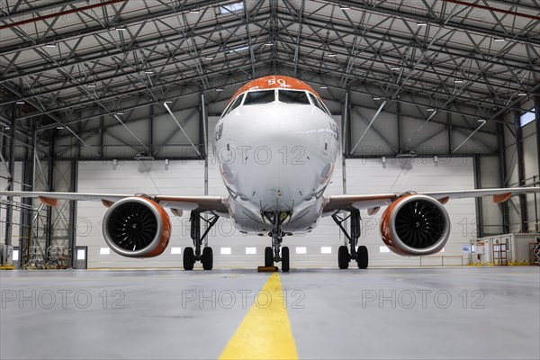An easyJet Airbus A320 neo stands in the newly opened easyJet maintenance hangar. The entire European easyJet fleet is now maintained at the Schoenefeld site, 11.01.2023