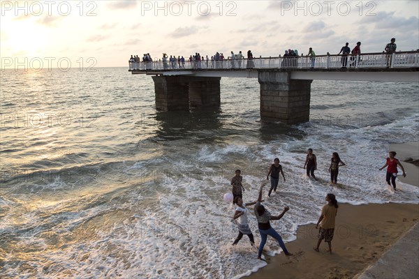 Young women playing on the beach Colombo, Sri Lanka, Asia
