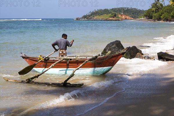 Fishing using traditional outrigger canoes, Mirissa, Sri Lanka, Asia