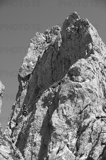Climber abseiling on the Rosssteinnadel, mountaineering village Kreuth, Mangfall mountains, Bavarian Prealps, Upper Bavaria, Bavaria, Germany, Europe