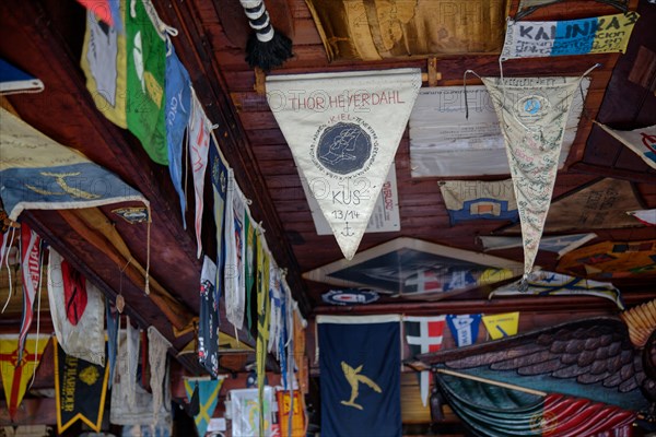 Colourful flags and pennants from Atlantic crossings hang from the ceiling of the famous Cafe Sport, Thor Heyerdahl, Horta, Faial Island, Azores, Portugal, Europe