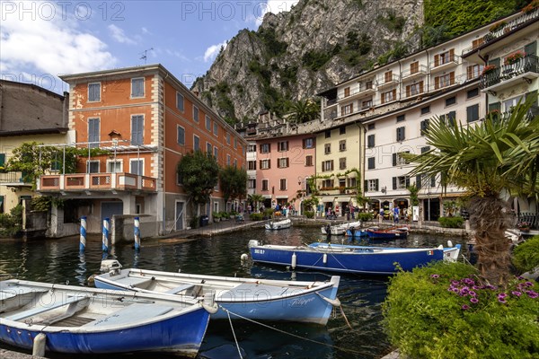 Houses and fishing boats in the old harbour of Limone sul Garda, Lake Garda, Province of Brescia, Lombardy, Upper Italy, Italy, Europe