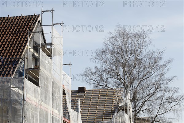 Scaffolded residential building, construction site, refurbishment, renovation, Bremen, Germany, Europe