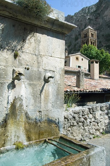 Old fountain at Moustiers-Sainte-Marie, Provence, Provence-Alpes-Cote d'Azur, Alpes-de-Haute-Provence, France, Europe