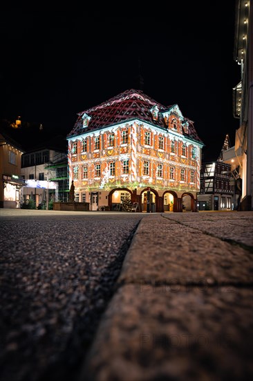 Colourful light projection on a half-timbered house at night, town hall, Nagold, Black Forest, Germany, Europe